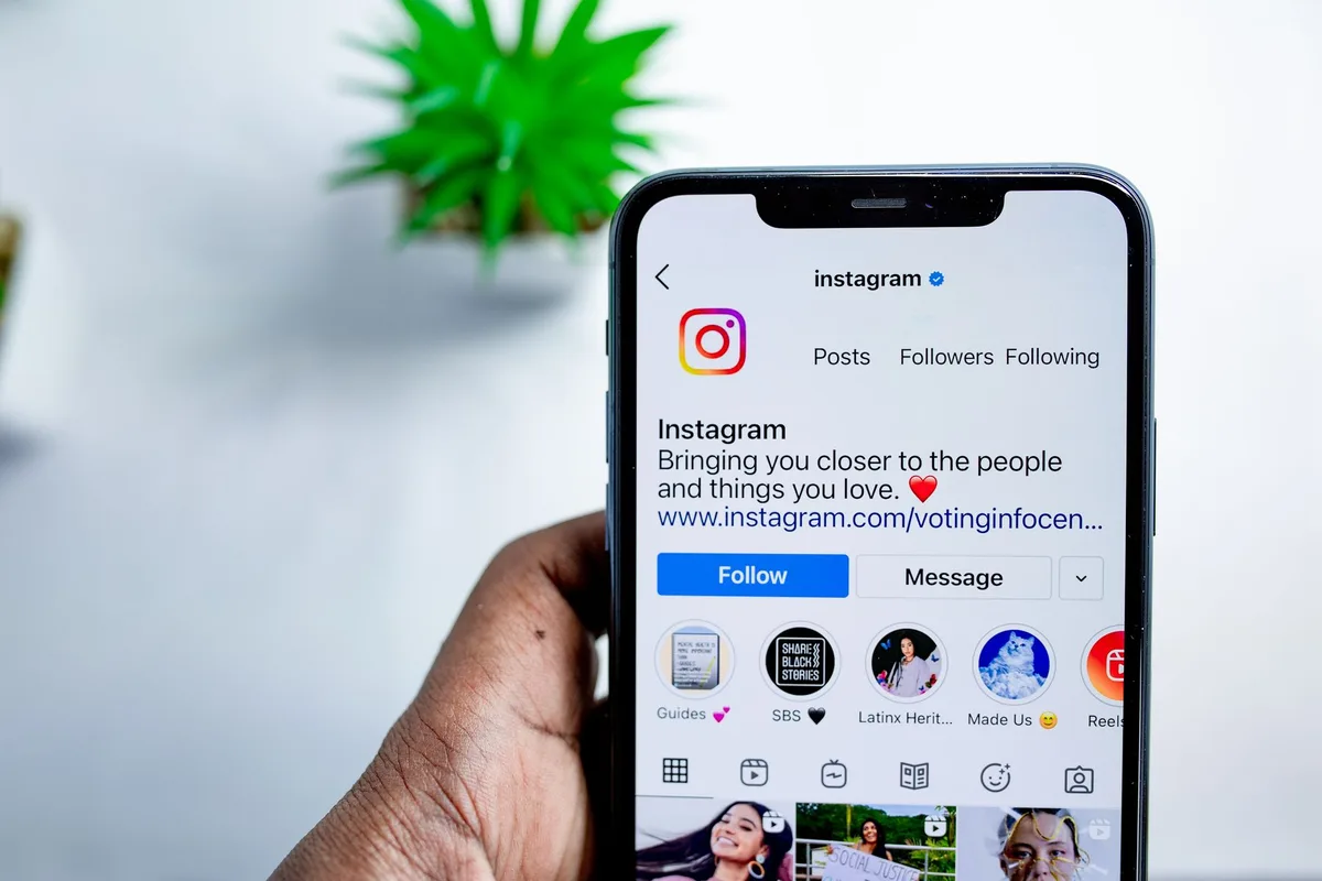 Creator reviewing Instagram engagement metrics on their phone