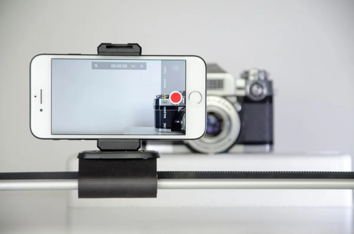 Smartphone recording vertical video on a tripod, set up for filming a YouTube Short