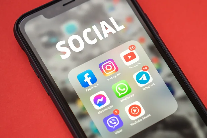 Smartphone screen displaying social media app notifications, representing LinkedIn engagement tracking